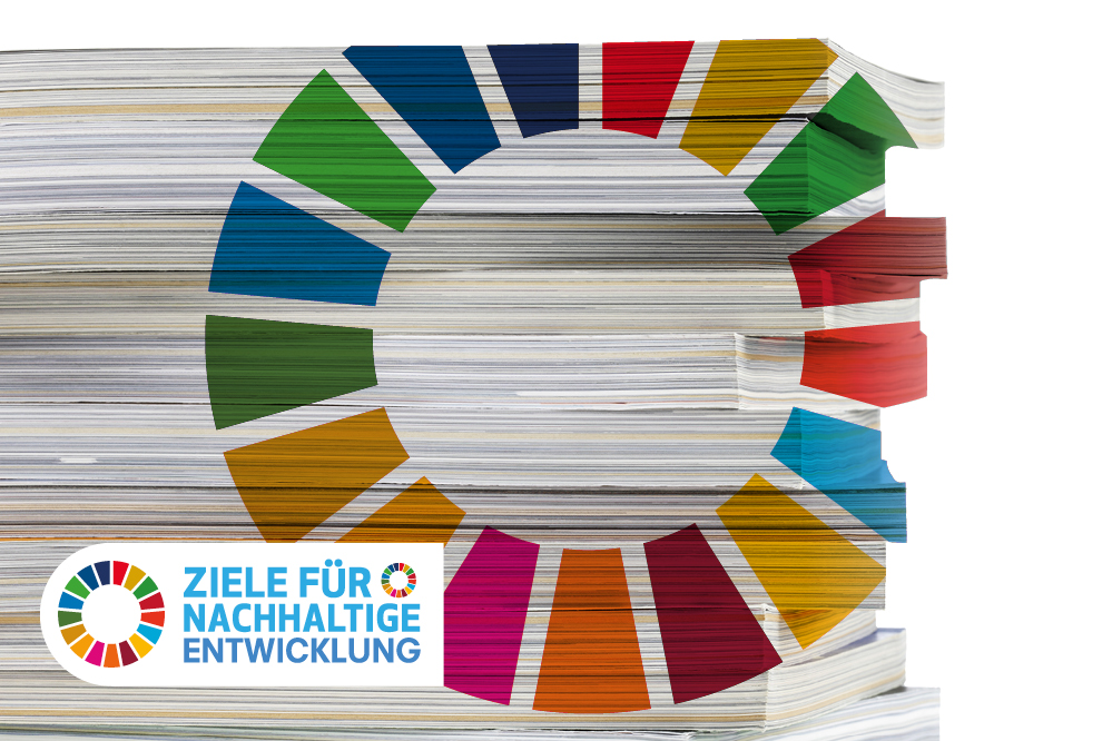 Bücherstapel mit Aufschrift UN Nachhaltigkeitsziele