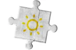 Sonne auf grauem Puzzleteil