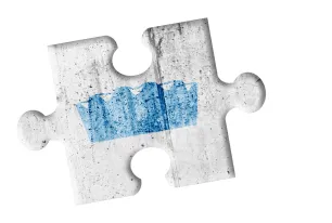 blaues Audimax auf grauem Puzzleteil