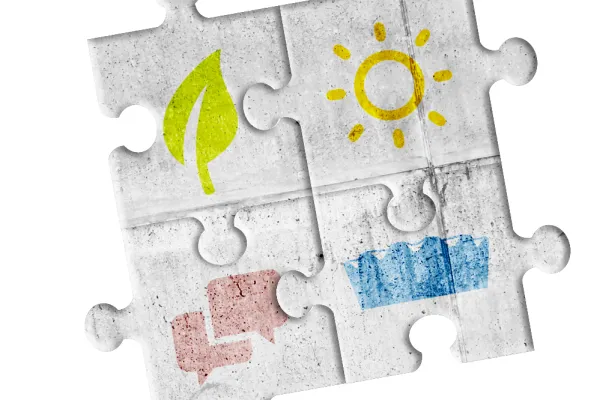 bunte Icons auf grauen Puzzleteilen